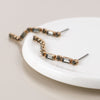 POM Golden smoky crystal strand earrings