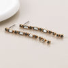 POM Golden smoky crystal strand earrings