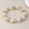 POM Silver plated and golden stars stretch bracelet
