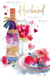 Table Setting With Champagne And Roses Card